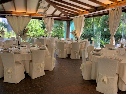 The dining room at Hostaria Antica Roma, set for dinner.